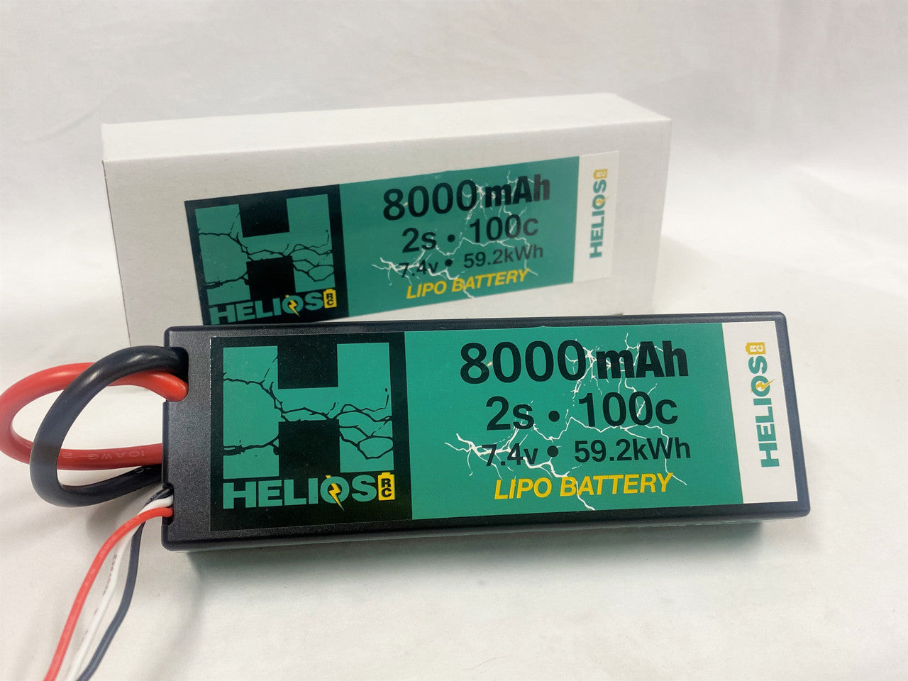 one 8000 mah 2s 100c 7.4v 59.2 kWh lipo battery in front of its packaging