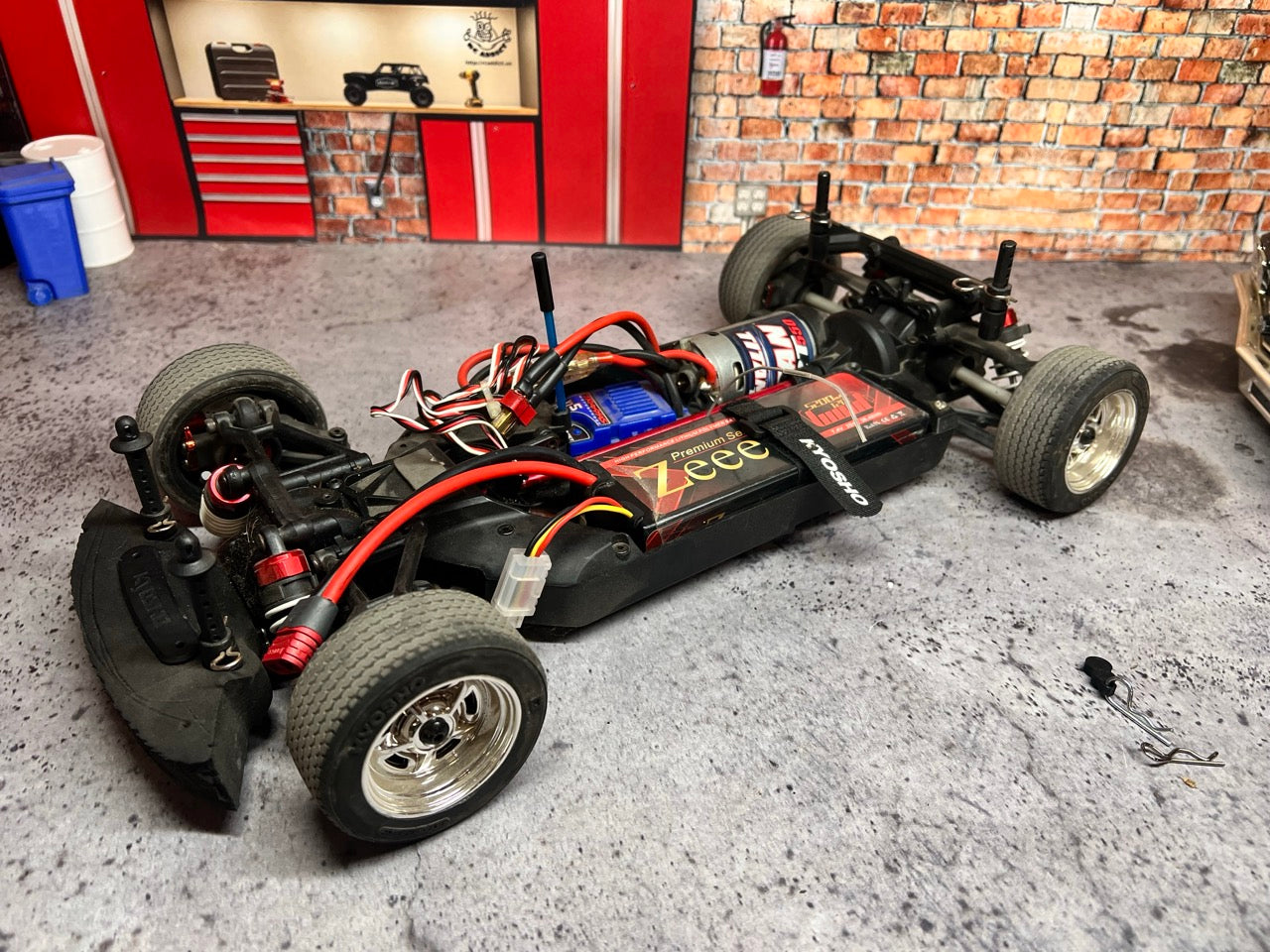 Kyosho Fazer Mk2 Touring Car/Chassis RTR chassis with visible wiring in a garage setting