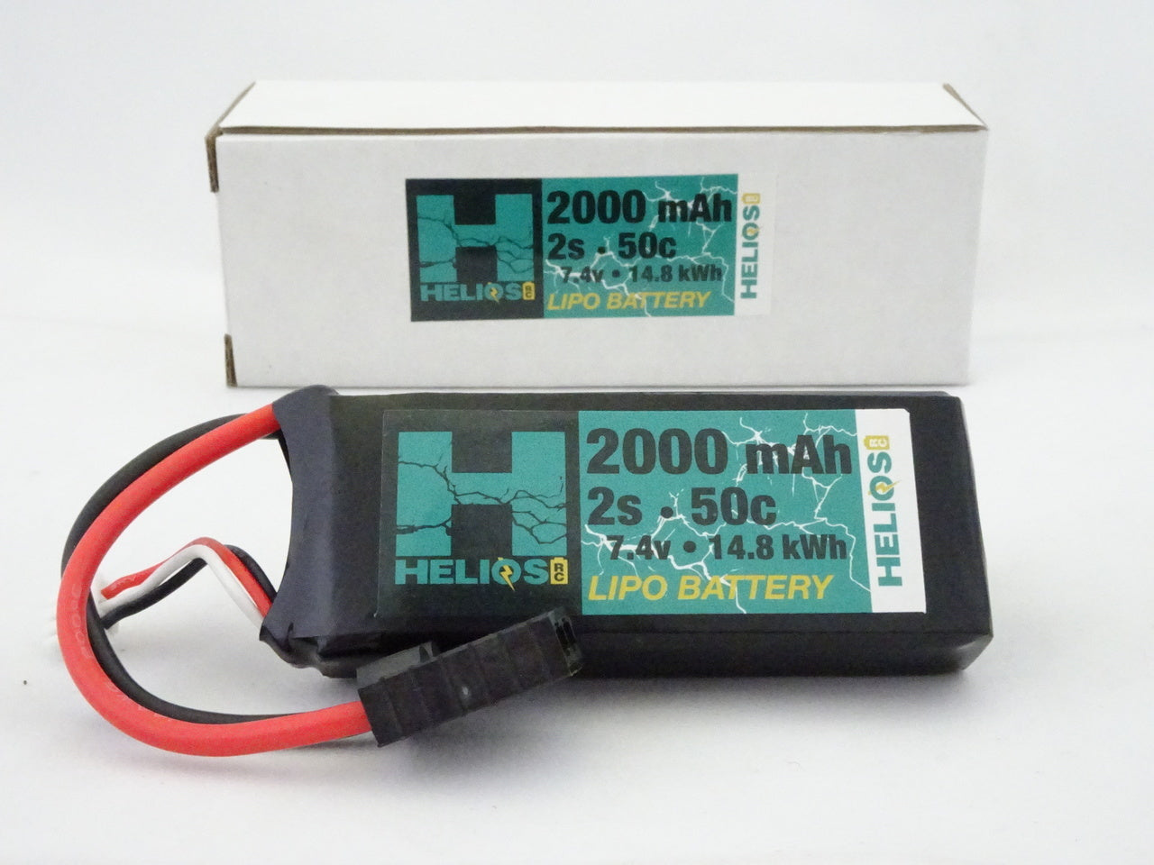 A black 2000 mAh 2S 50C Lipo battery with red and white connectors, alongside its packaging.