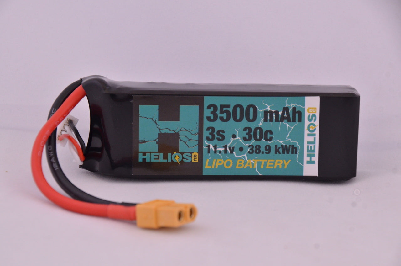 A Helios RC 3S 3500 mAh 30c Lipo battery with a Deans XT60 connector, predominantly black with a graphic design and white text on the label.