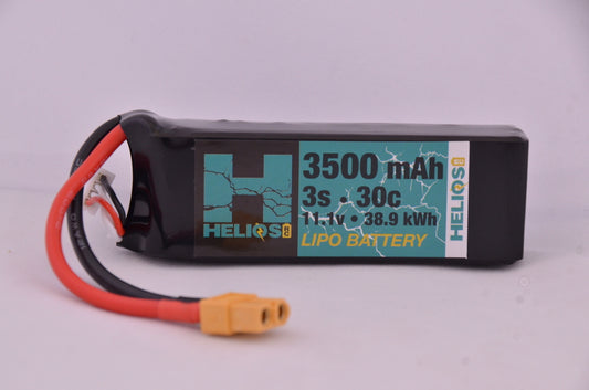 A Helios RC 3S 3500 mAh 30c Lipo battery with a Deans XT60 connector, predominantly black with a graphic design and white text on the label.
