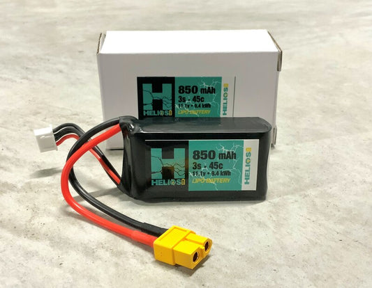 A Helios RC 3S 850 MAH 45C LIPO battery with XT60 connector, next to its packaging box. -1