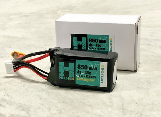 A Helios RC 850 mAh 45C Lipo battery with XT60 connector alongside its packaging.