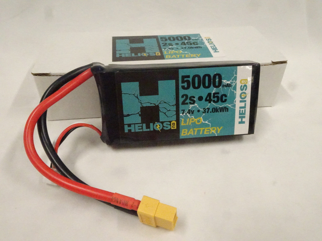 one2s 5000mah Lipo Battery in front of its package 