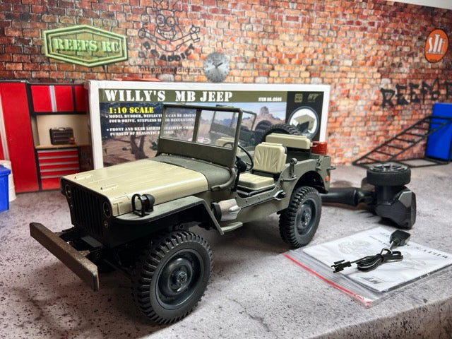 Model Willys MB Jeep on a display stand with a brick wall background -1