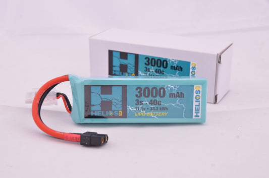 A blue 3000 mAh Helios RC Lipo battery pack with red wiring and a label displaying capacity and voltage information.